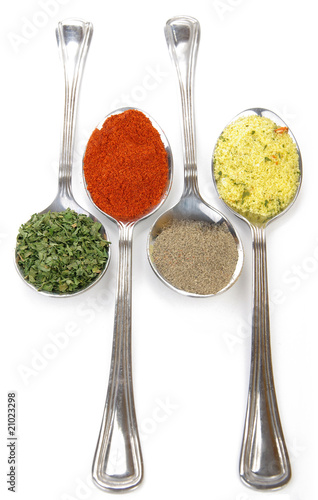 Four spoons with spices