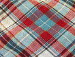 Foto: A background image of some plaid fabric A background image of some plaid fabric