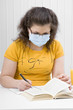 girl student in a medical mask