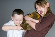 Young kids fighting over toy