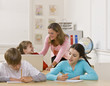 Teacher helping student