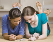 Teenage girls sharing mp3 player