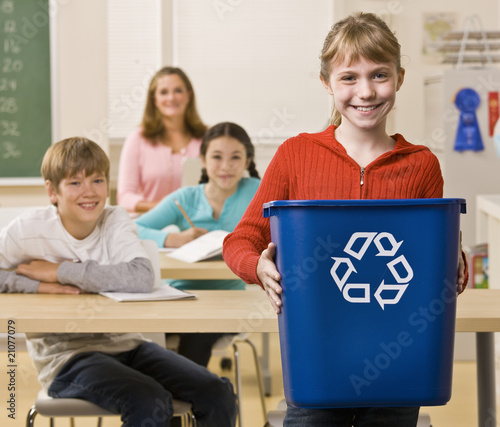 Photo: Student carrying recycling bin Student carrying recycling bin