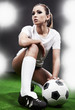 Sexy soccer player, woman on playing field
