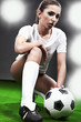 Sexy soccer player, woman on playing field