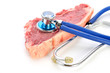 stethoscope on meat