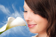 Photo: Young woman holding a white flower Young woman holding a white flower