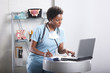 Cute afro-american doctor at her office