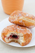 Jam donut with bite taken out