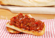 bruschetta on red and white napkin