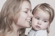 Young mother is overjoyed with her toddler