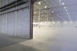 Foto: Access door to brightly lit and empty warehouse Access door to brightly lit and empty warehouse