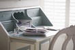 Letters tied with ribbon on writing desk