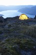 Tent by lakeshore at dusk