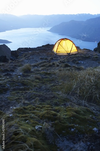 Photo: Tent by lakeshore at dusk Tent by lakeshore at dusk