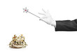 Magician holding a magic wand and a frog isolated on white