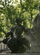 lovely sunlit fountain with an angel and drops of water in the a