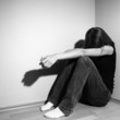 Foto: Young woman suffering from a severe depression (very harsh light Young woman suffering from a severe depression (very harsh light