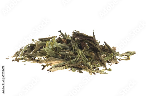 Photo: Dried Stevia Rebaudiana - natural sweetener isolated on white Dried Stevia Rebaudiana - natural sweetener isolated on white