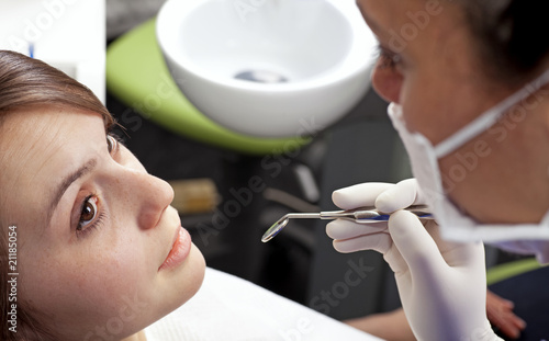 Photo: young woman in dentists office young woman in dentists office