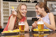 Foto: Happy girlfriends in a bar Happy girlfriends in a bar