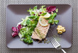 Salmon dish with salad