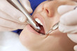 Photo: Young woman in dentists office Young woman in dentists office