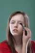 girl putting on makeup