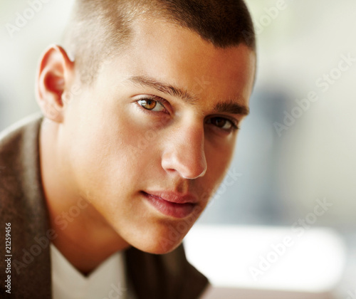 Photo: Closeup portrait of confident young man Closeup portrait of confident young man