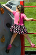 Child Climbing a Rock Wall