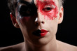 a man with colored painted face