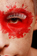 a man with colored painted face