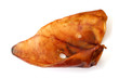 Smoked pig ear for a dog isolated on white background