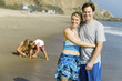 Couple with Family Enjoying Beach