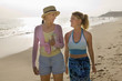 Mother and Daughter Walking on Beach