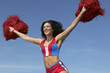 cheerleader running with pom poms raised