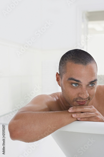 Photo: man relaxing in bathtub man relaxing in bathtub