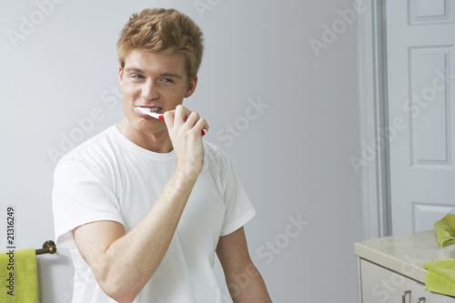 Photo: Man Brushing Teeth Man Brushing Teeth