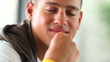 Happy young man in pensive mood