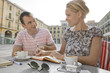 Man and woman sitting at outdoor cafe