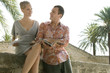 Photo: Man and woman reading guidebook Man and woman reading guidebook