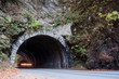 car passing through mountain tunnel