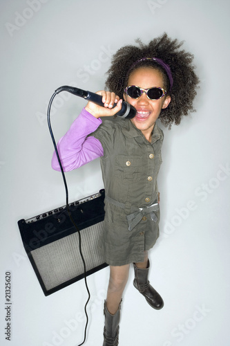 Photo: Girl with sunglasses singing Girl with sunglasses singing