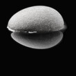Stone isolated on black. Reflected.