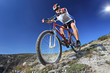 Photo: Person riding a bike downhill style Person riding a bike downhill style