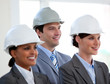 A diverse team of architects standing during at a conference