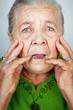 Scared and worried senior woman with wrinkles