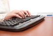 Elegant hands typing on the keyboard