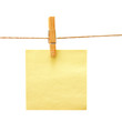 Yellow reminder with clothes peg over white