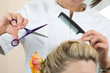 Hairdresser makes hair young women